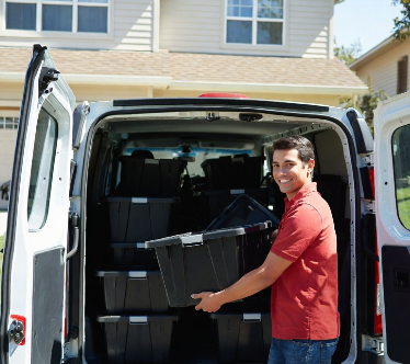 ToteRental team loading totes back into the delivery van after a completed move
