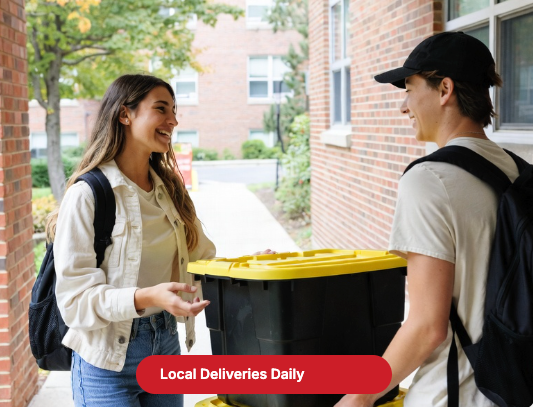 University students carrying black totes with yellow lids on a Canadian campus
